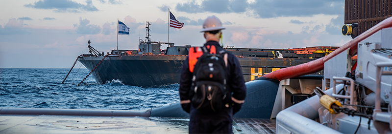 man looking at ship